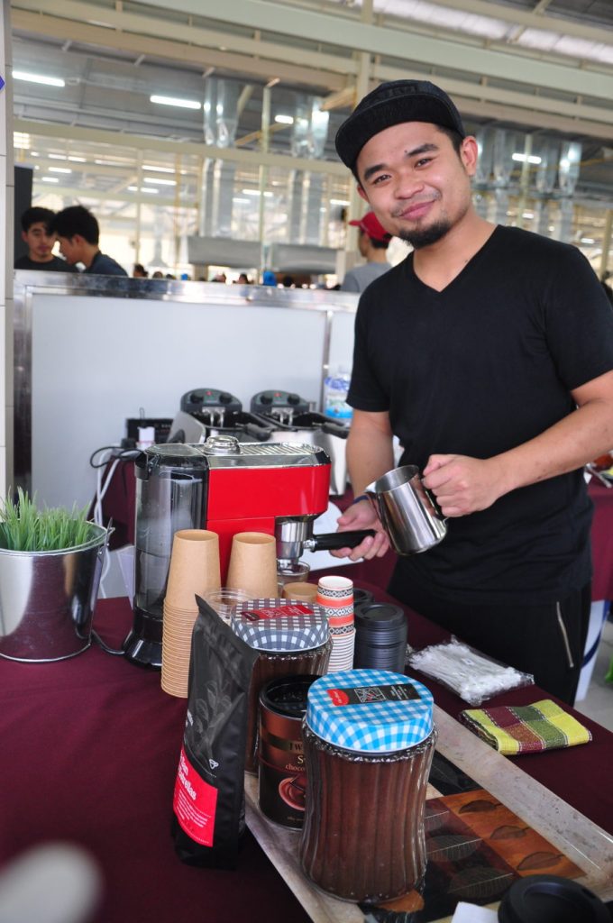 Md Safwan making some coffee at his stall at the Pasar Pelbagai Barangan in Gadong.