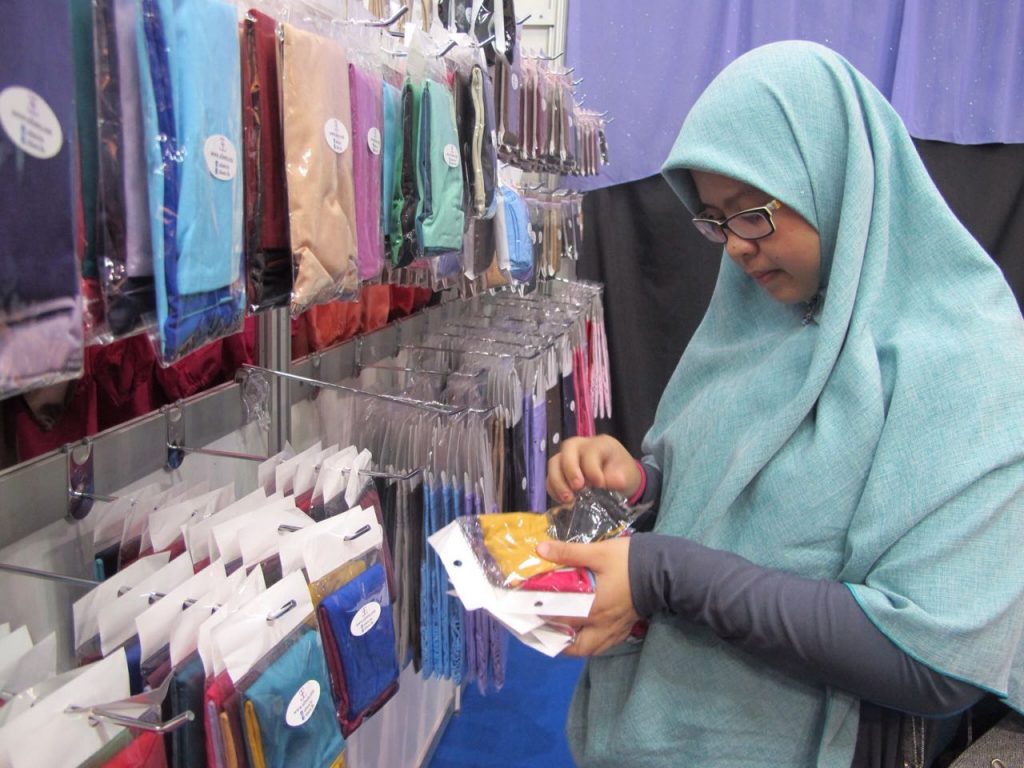 A customer browsing through Afeera BN hand sleeves at a pop-up event recently.