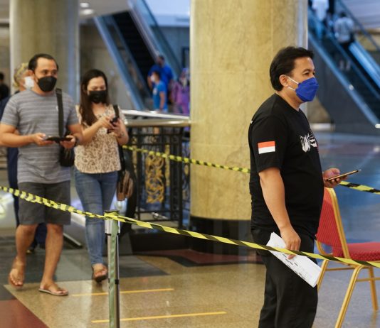 Government introduces sector guidelines, fines for transition phase People entering premise during second wave