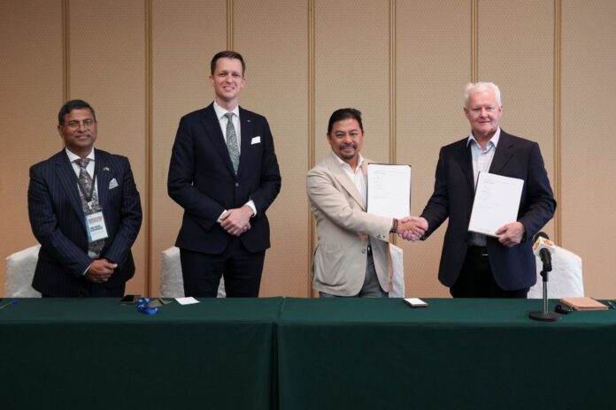 Director of AgriGen Ross Brierty (right) and Chairman of FarmFresh Dr. Nasir Latif (second from right) exchange the signed MoA for the establishment of BIAL, witnessed by Australian High Commissioner to Brunei Michael Hoy (second from left).