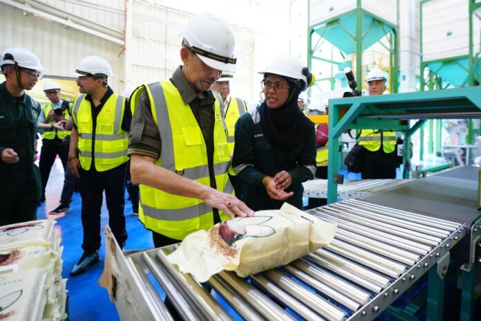 His Majesty inspects WMC’s new vacuum-sealed five-kilogramme rice packaging during the launch of the upgraded milling facility in Wasan.